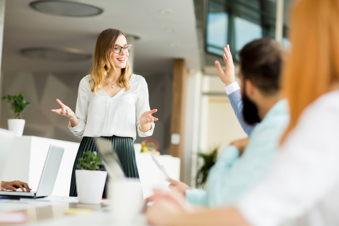 Young Woman Presenting in a Team Meeting